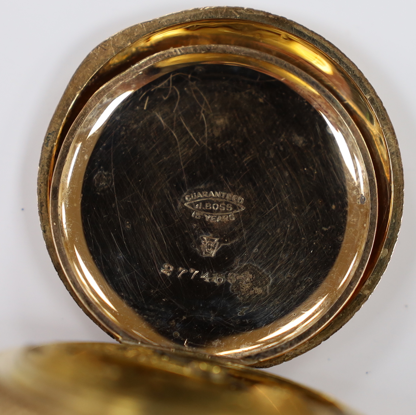 An American Waltham engraved gold plated hunter pocket watch, case diameter 42mm, together with a 9ct double strand chain, 39cm, chain 29.6 grams.